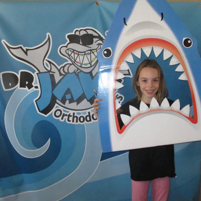 Dr. JAW patient having fun in the shark photo booth